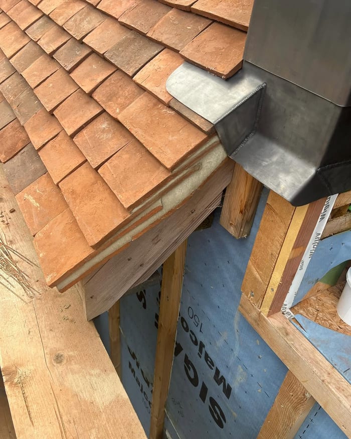 Tile and flashing detail at a dormer roof